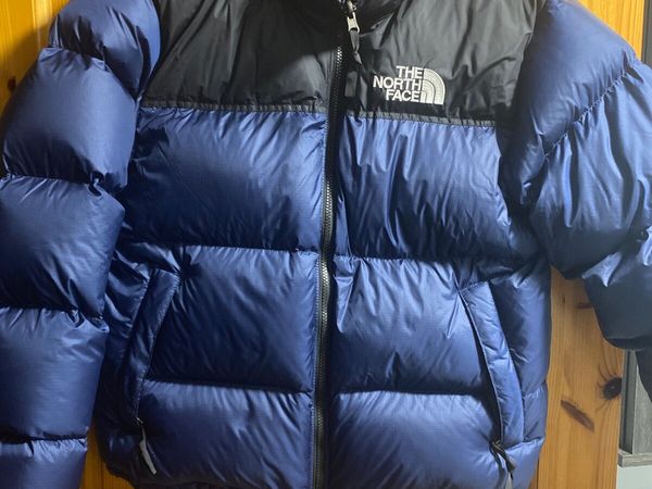 Dark blue north face puffer jacket hotsell