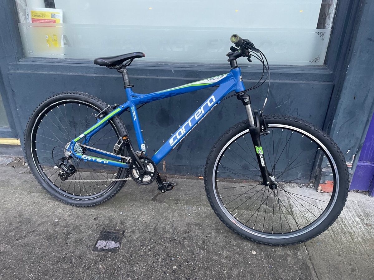 Carrera blue store and green bike