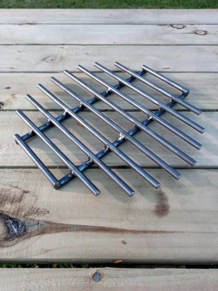 Metal for grill outlet grate