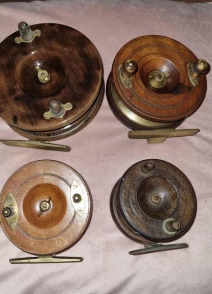 Selection of wood and brass fishing reels