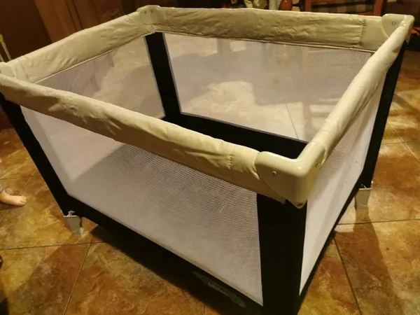 Kiddicare travel cot online