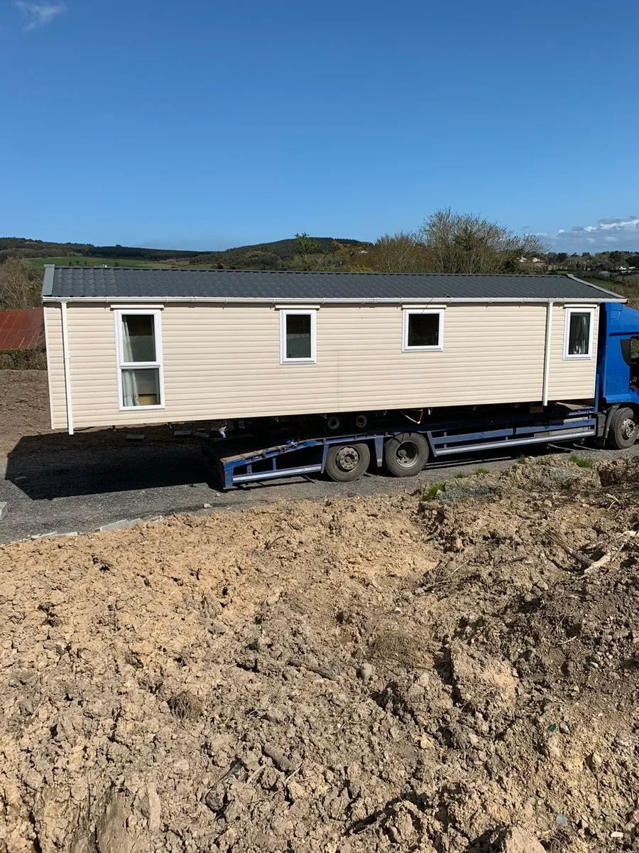 Mobile home transport and crane