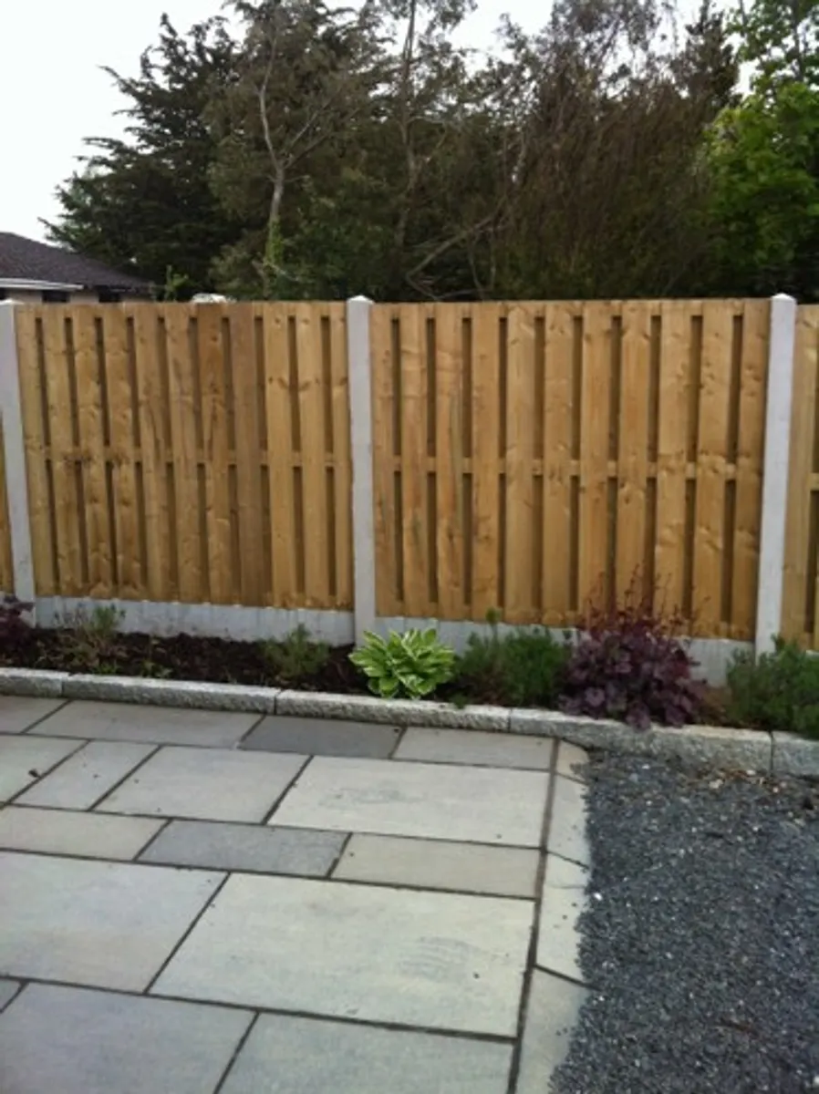 Concrete post and panel fencing