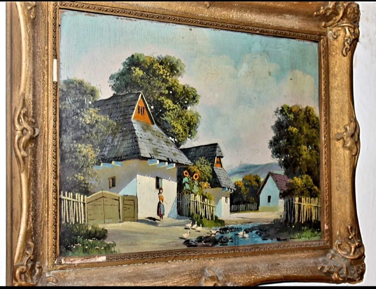 Antique oil painting of a thatched cottage
