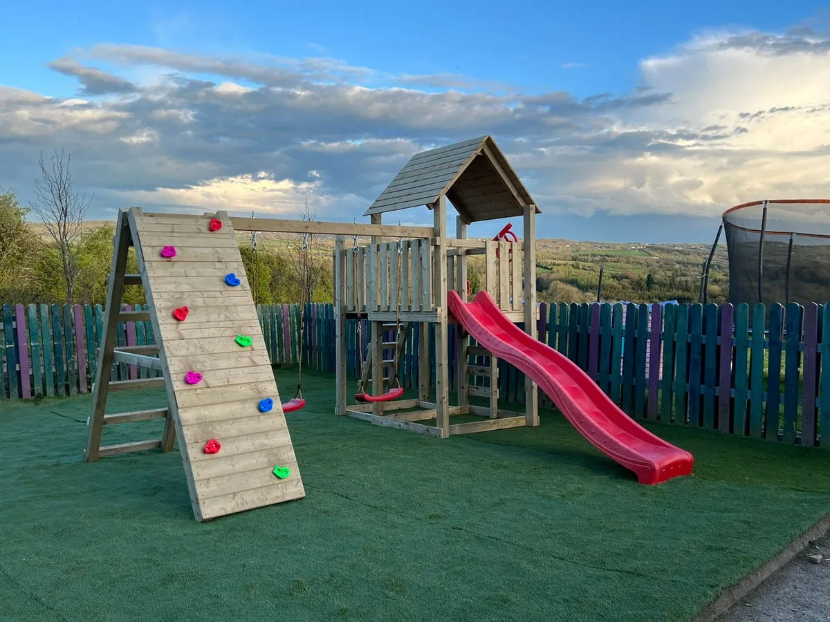 Playtower with slide, swings and climbing wall - Image 1