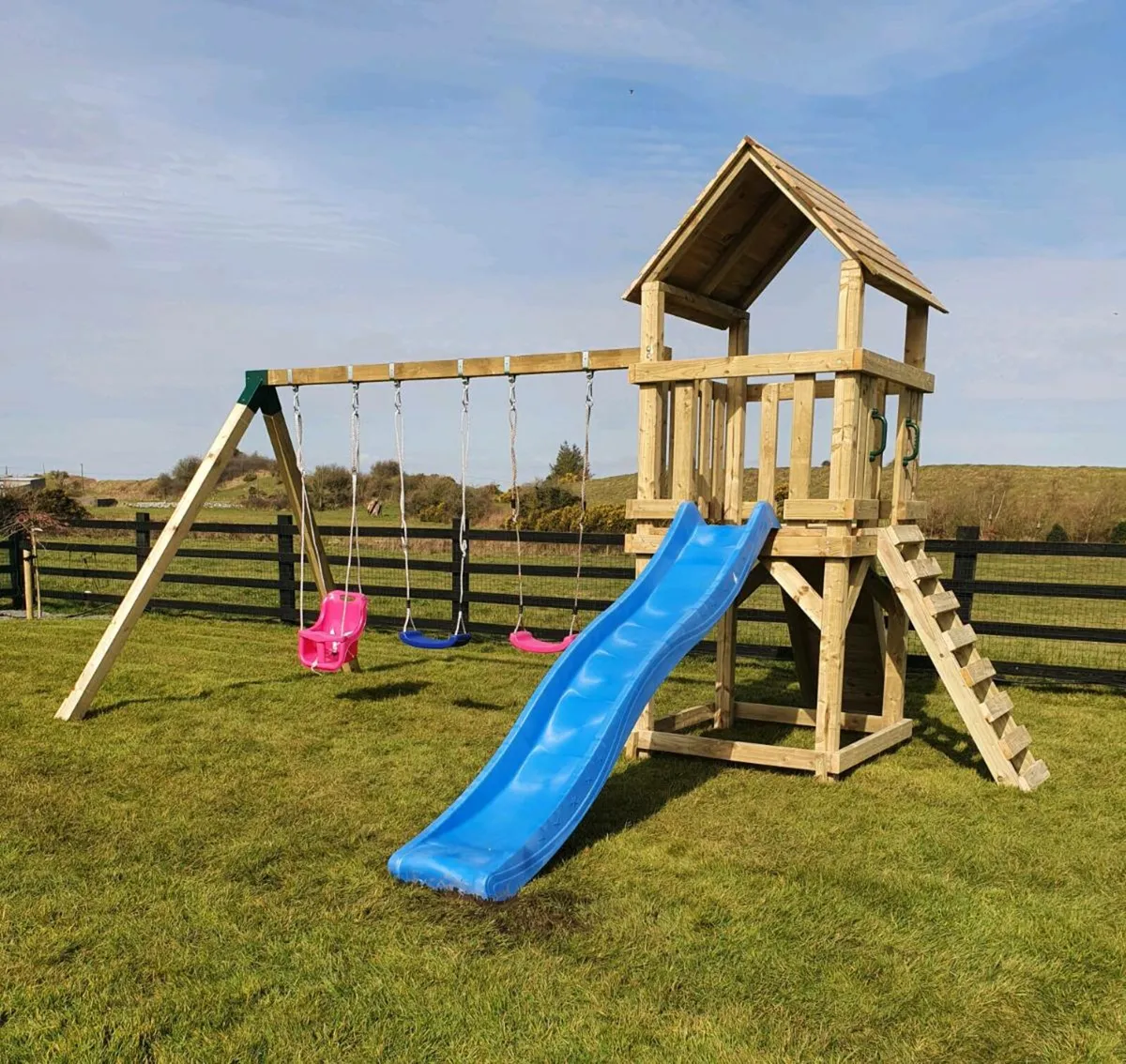 Wendy house with store slide and swing