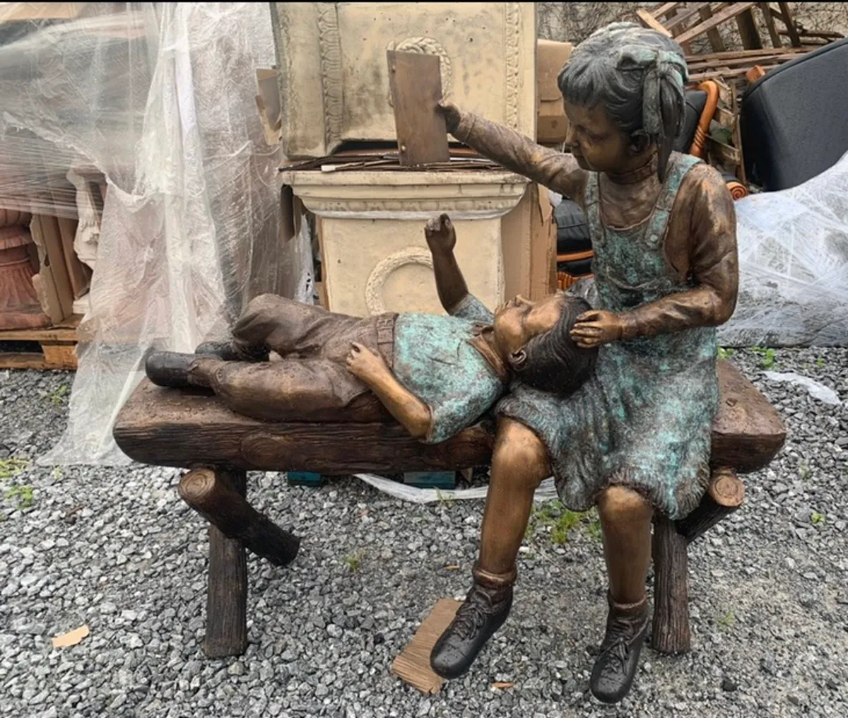 Bronze boy and girl on log bench - Image 2