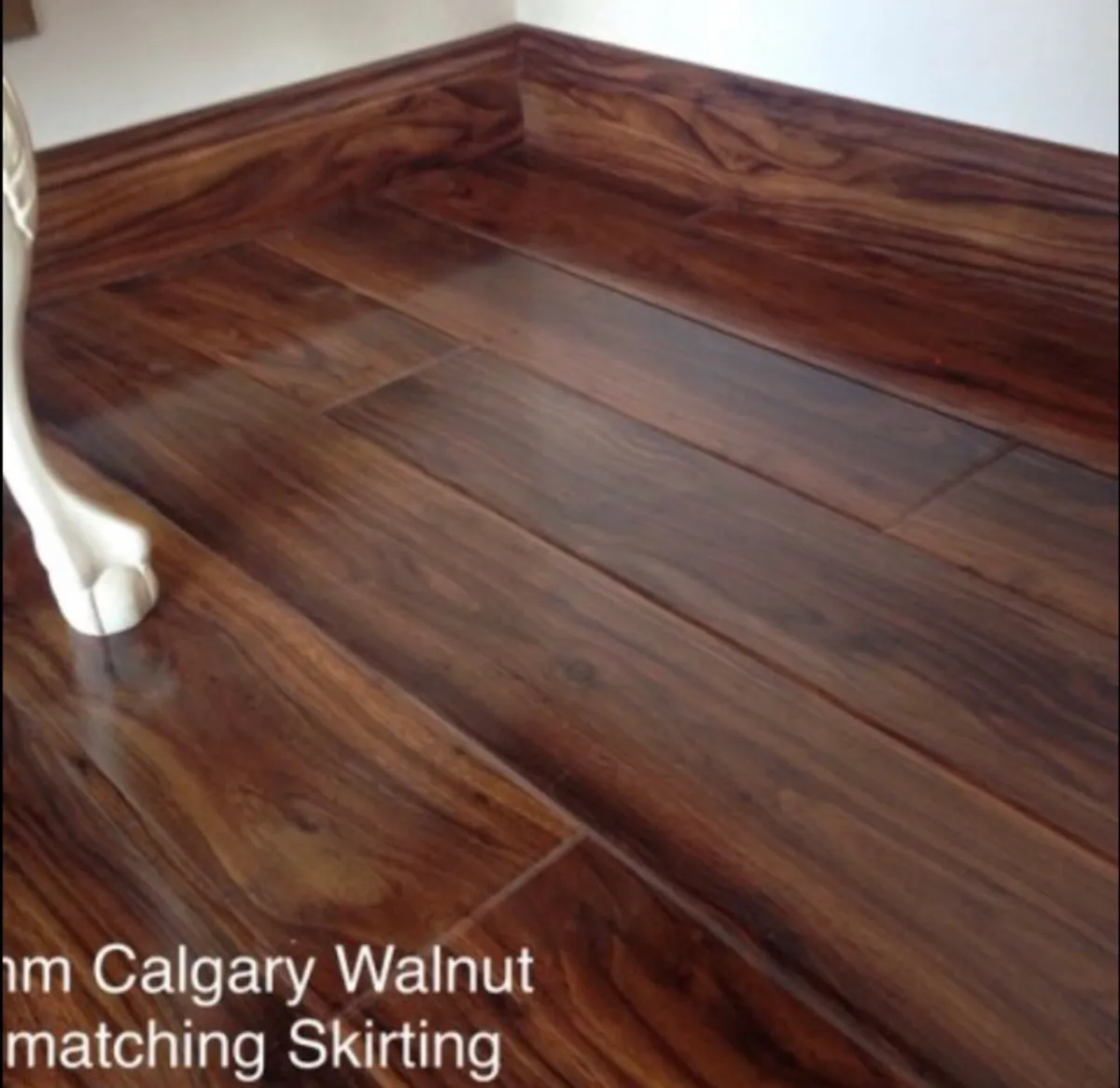 New 12.3mm Calgary Walnut High Gloss Laminated - Image 1