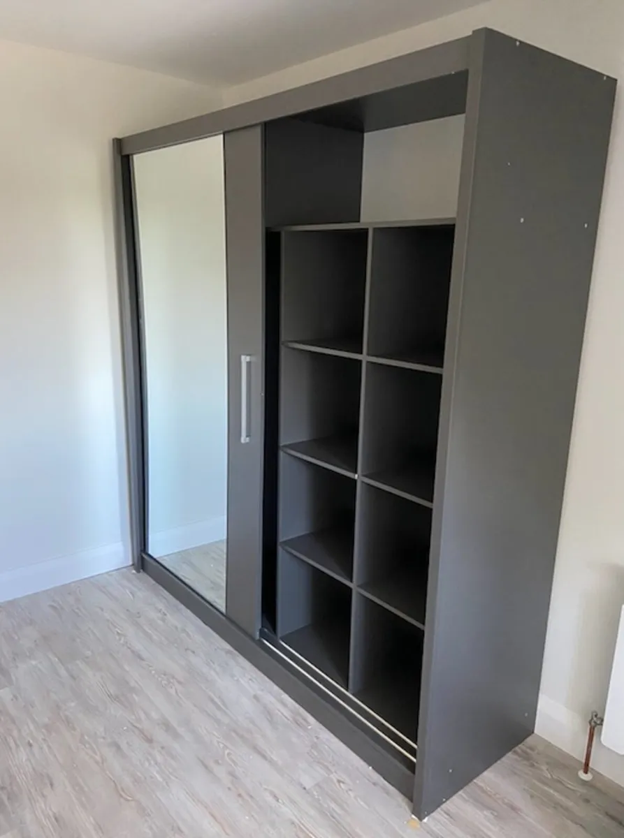 Wardrobe with sliding online doors and shelves