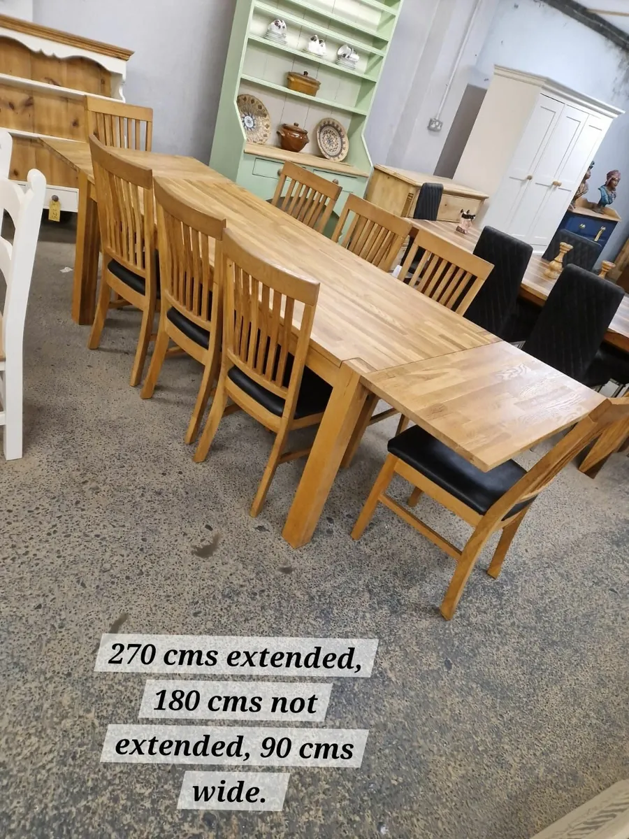 Oak extending dining table outlet and 8 chairs