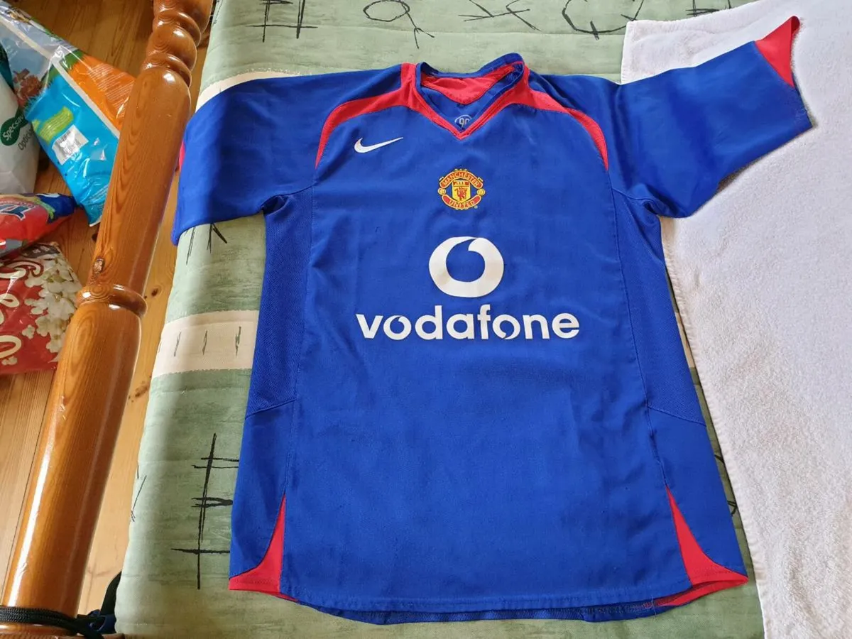 Man united store blue vodafone kit