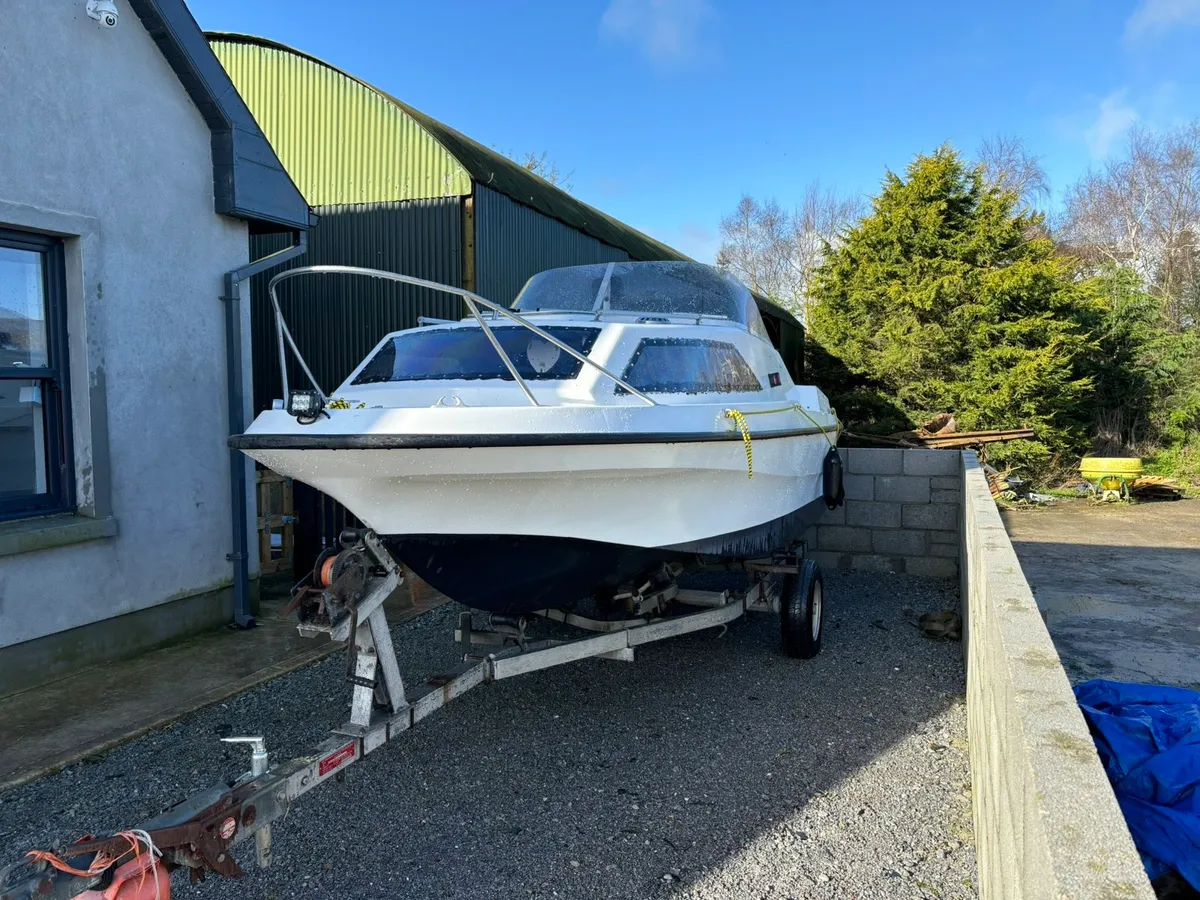 Boat and spare engine for sale