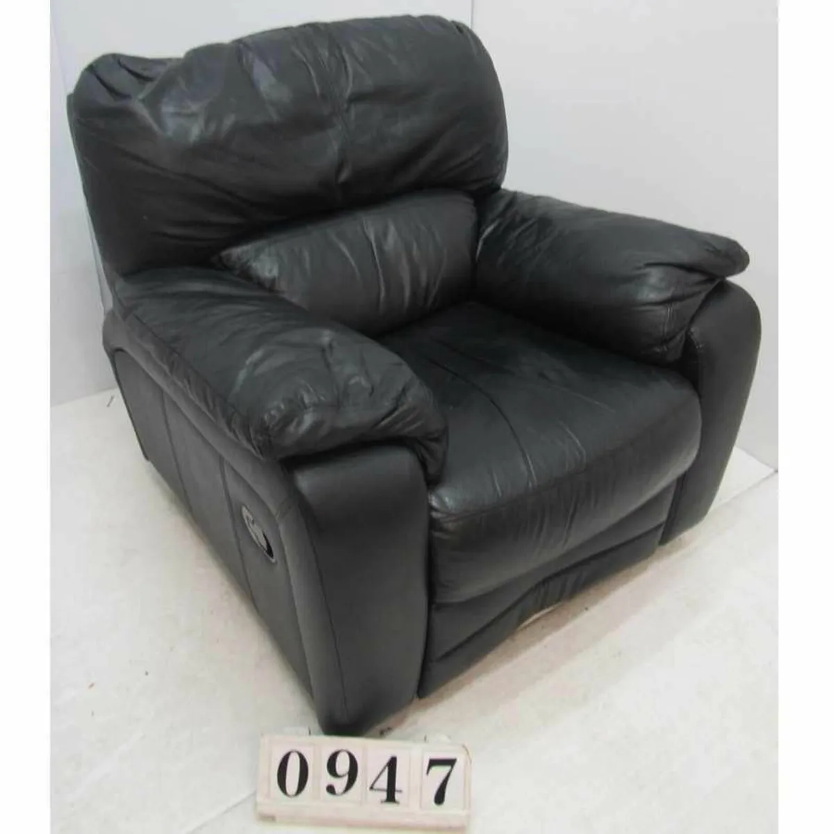 Black recliner armchair. #0947