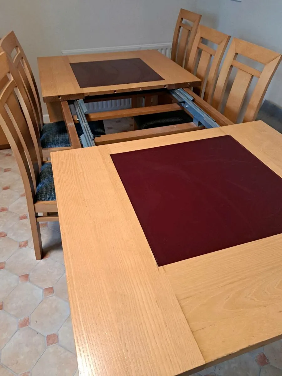 Oak Kitchen/Dining table with 8 chairs.