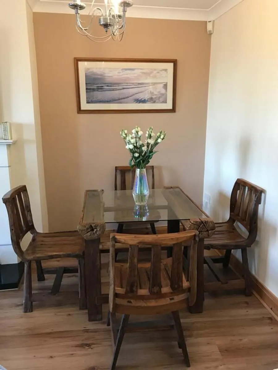 Cottage style solid reclaimed wood table and 4 chairs.