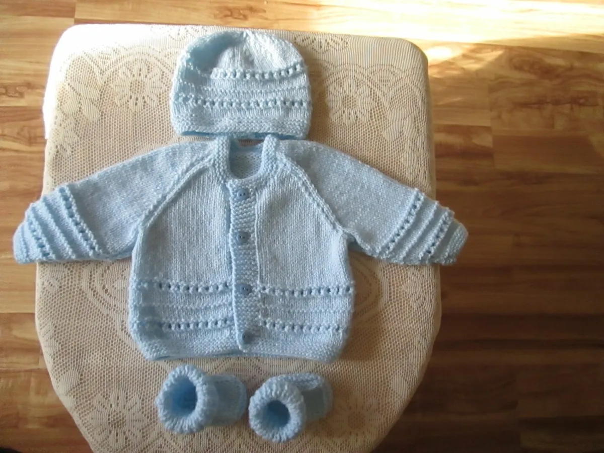 Hand knitted Baby Cardigans hats & booties.