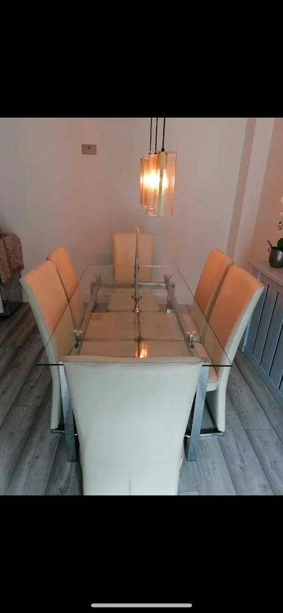 SOLDGlass dining table with 6 cream leather chairs