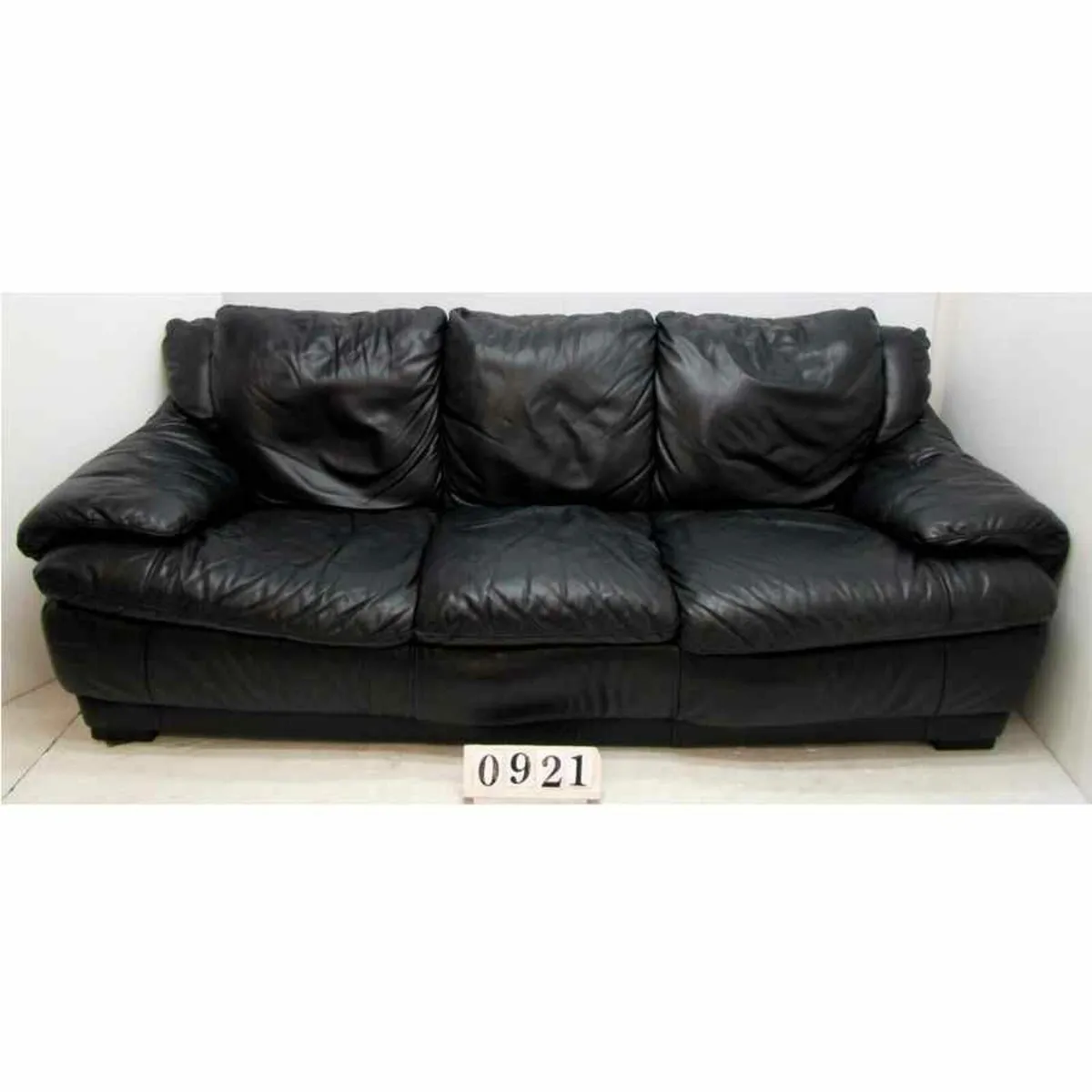 Large black leather three seater sofa.   #0921