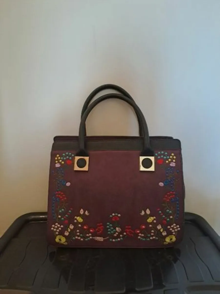 Embroidered burgundy handbag