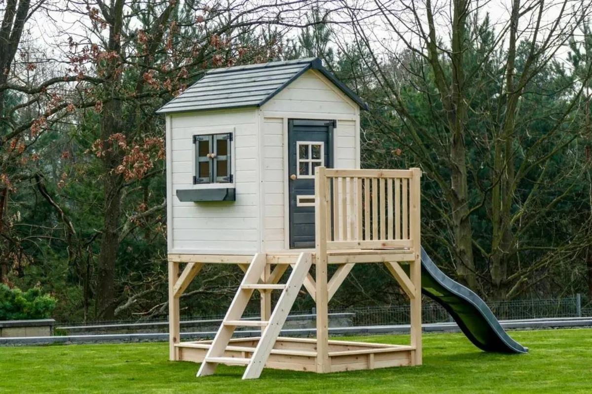 Wooden garden house for children with a platform