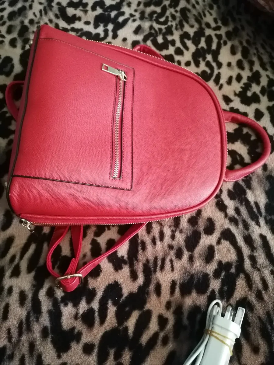 Red colors bag with  long straps