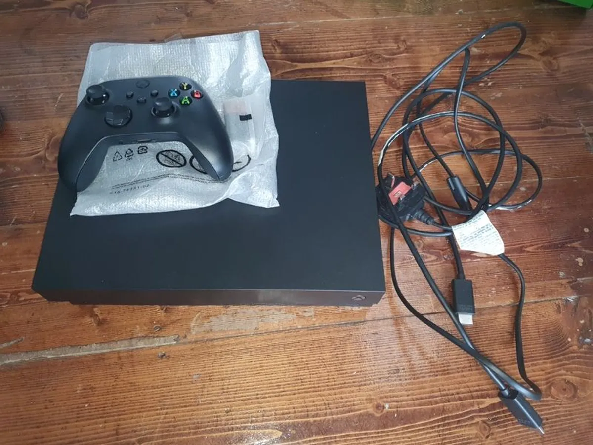 Xbox One X 1TB + 9 Games & New Controller