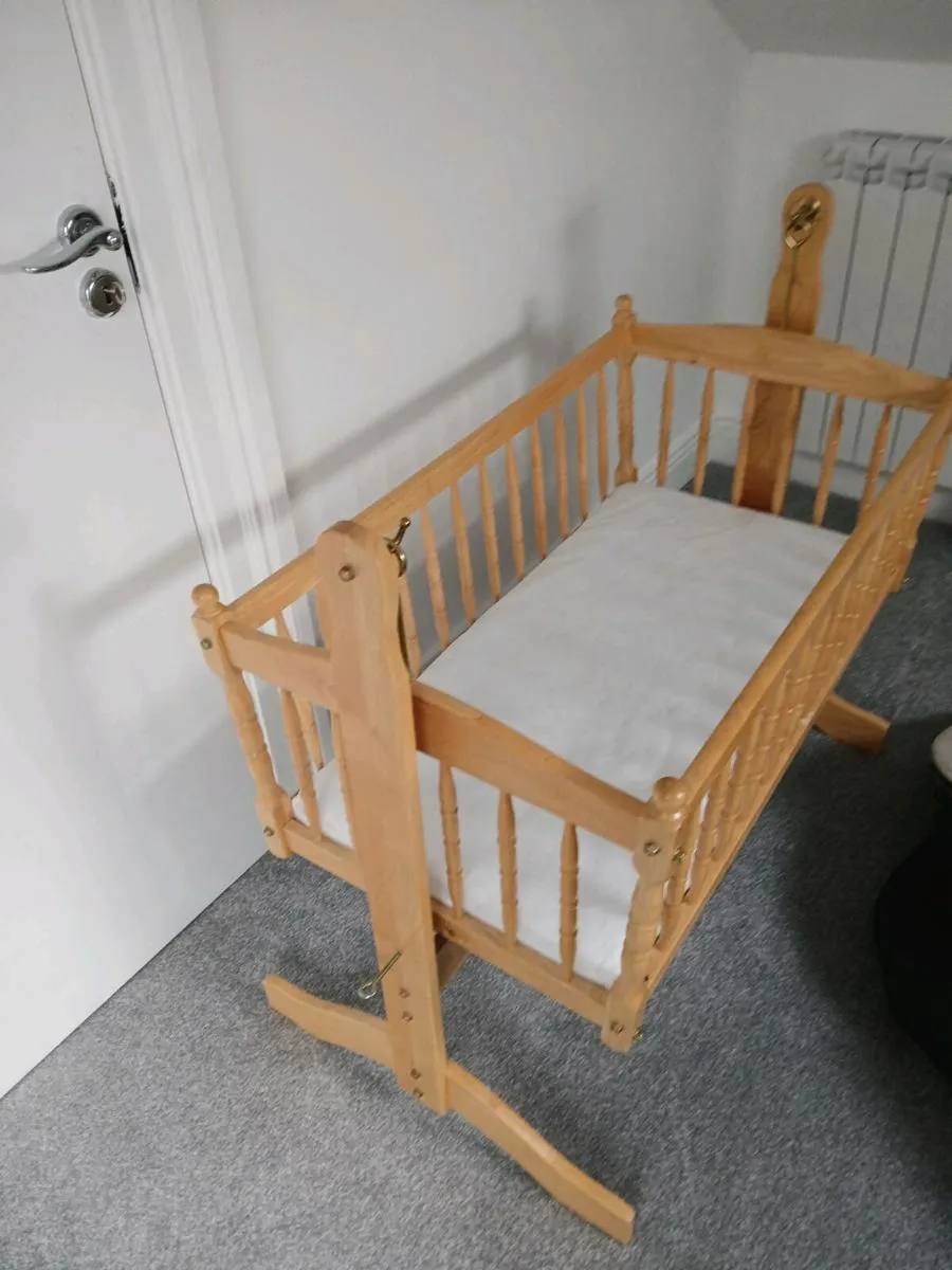 Little angels swinging crib best sale