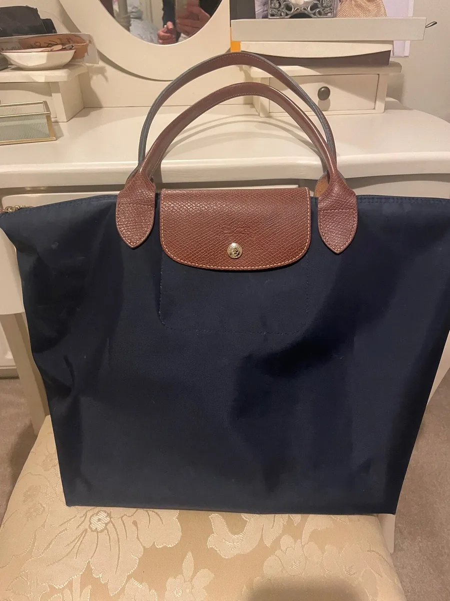 Medium navy long champ bag like new for sale in Co. Limerick for 40 on DoneDeal