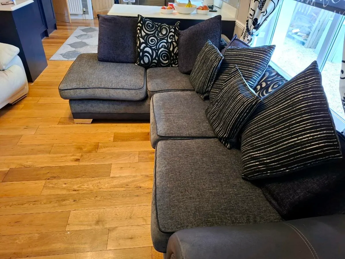 Large corner sofa in charcoal grey and black. - Image 2