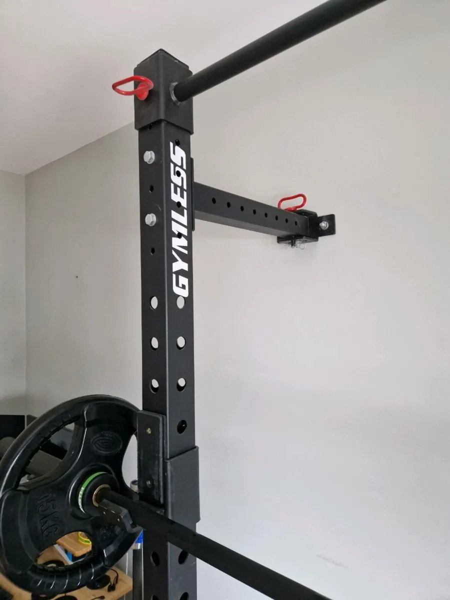 Home gym with wall-mounted rack, bars & weights - Image 3