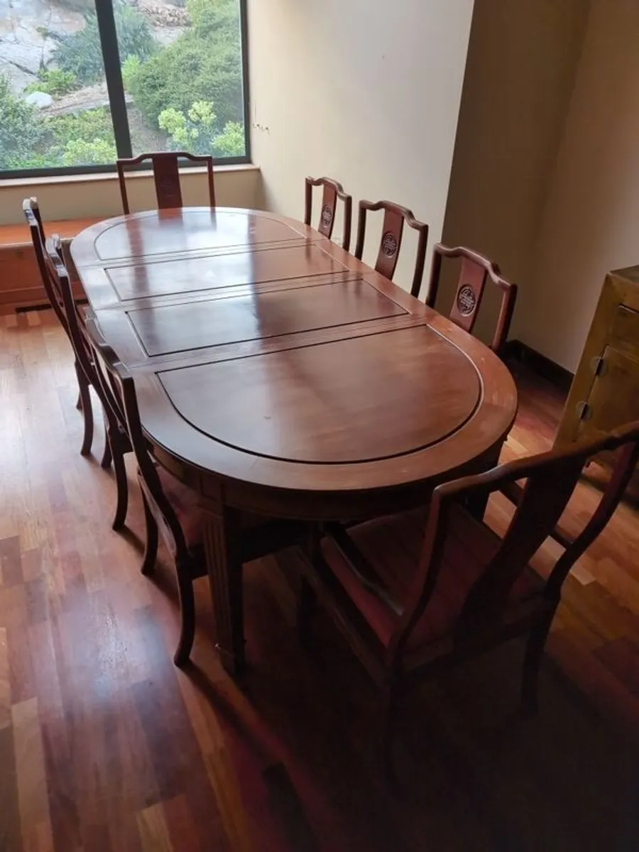 Rosewood dining table and 8 chairs