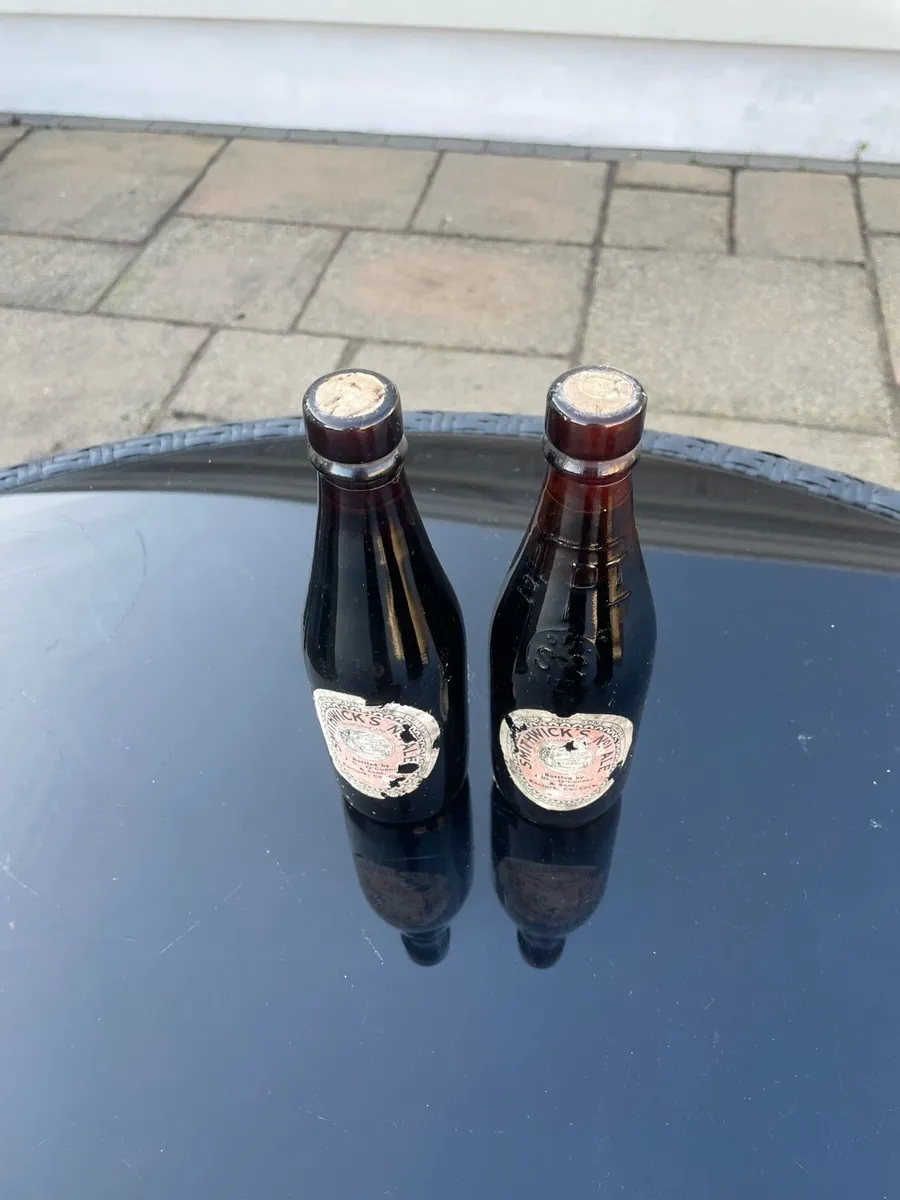 Pair of old Smithwicks 1/2 Pint Bottles - FULL - Image 1