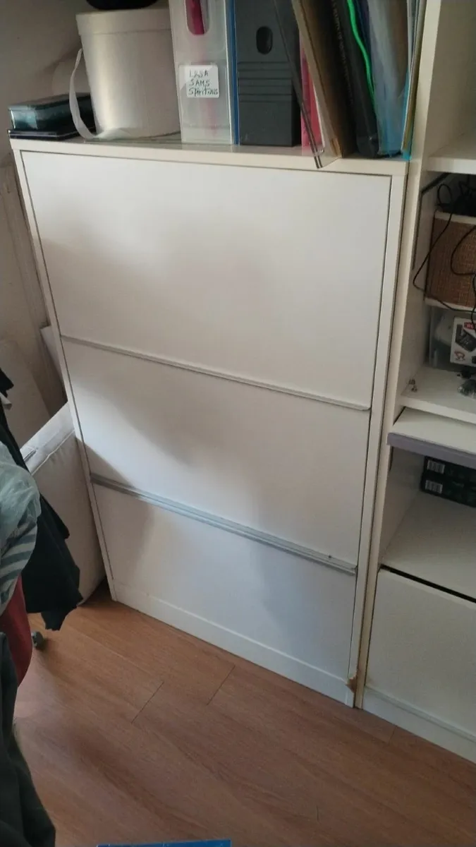 Minimalist white storage units. - Image 3