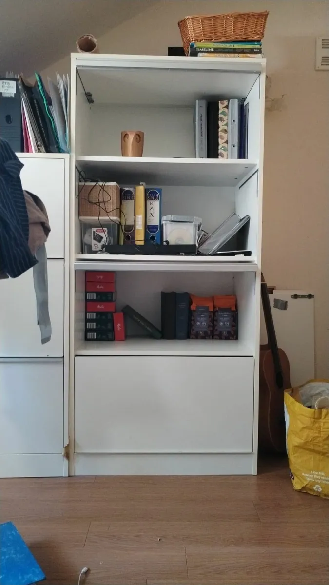 Minimalist white storage units. - Image 1