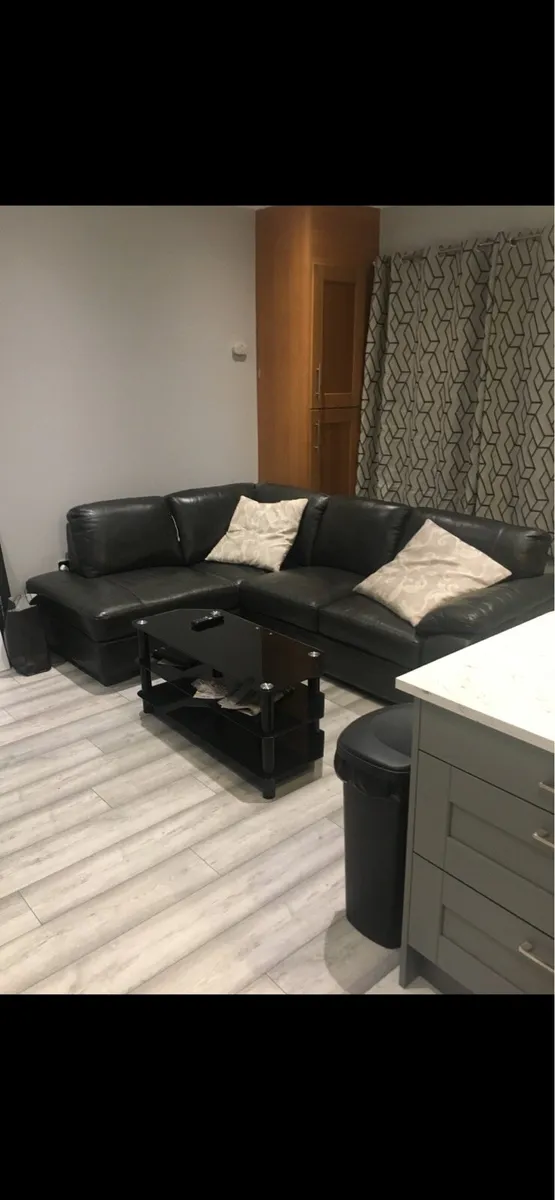 L shaped charcoal leather Couch - Image 1