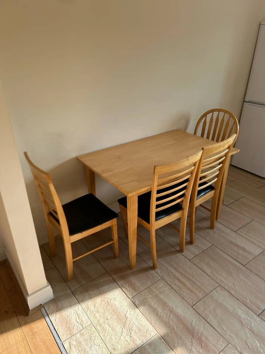 Table and three chairs