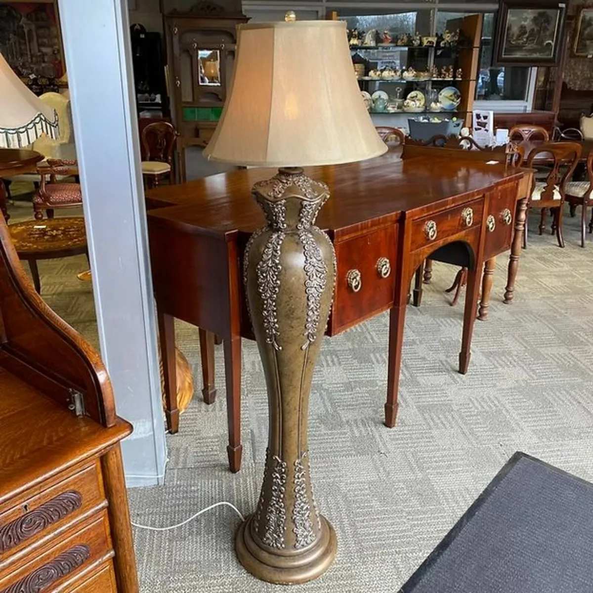 Art Nouveau-style floor lamp with deep cream shade