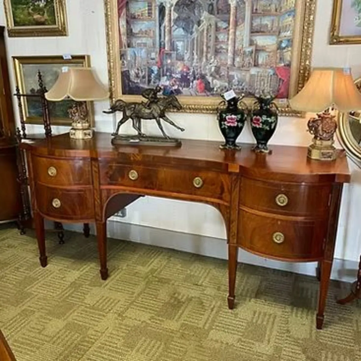 Fabulous Georgian mahogany serpentine sideboard. S