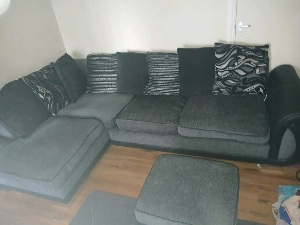 Black and dark grey corner sofa. With stool - Image 1
