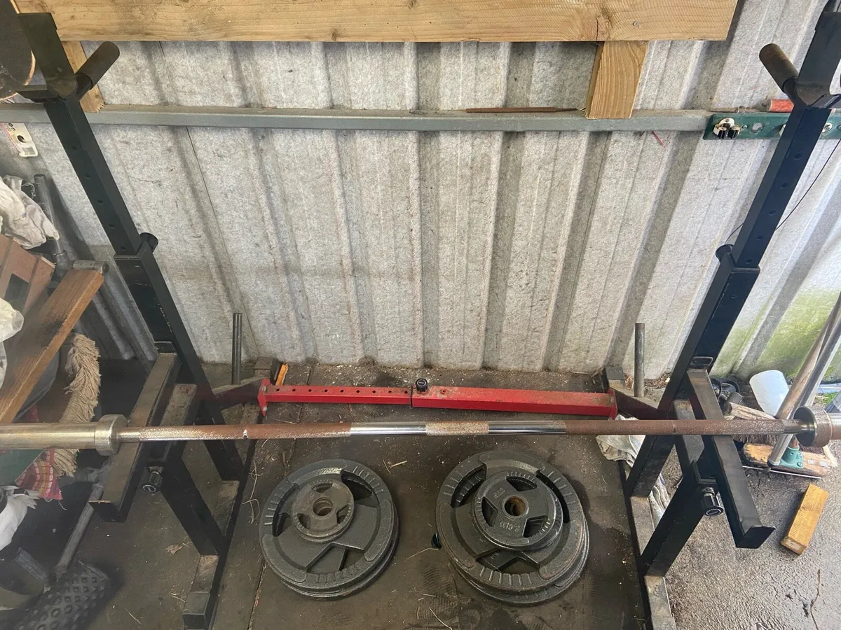 Adjustable squat rack with Olympic weight plates - Image 1