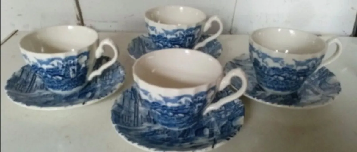 Four Vintage Blue and White Cups Saucers