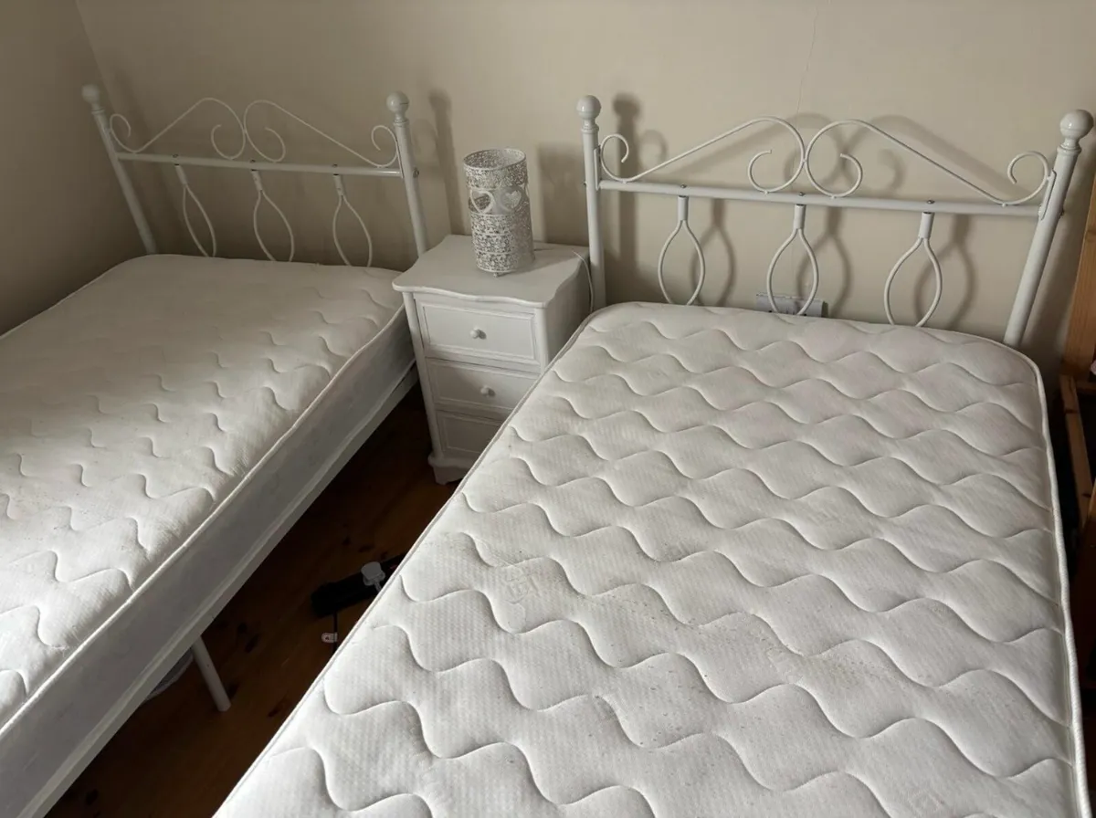 2 single bed frames and 2 single mattresses. - Image 2