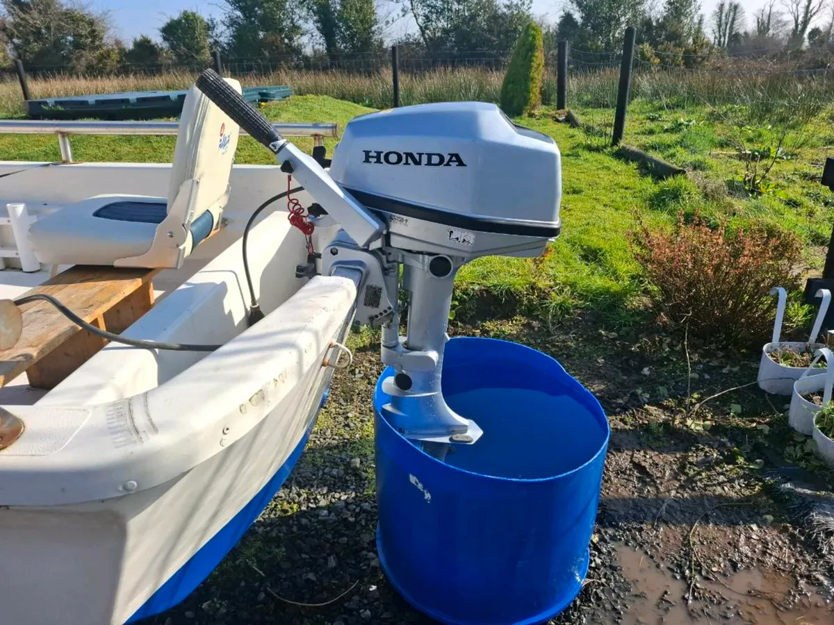 Dory boat, trailer and outboard - Image 1