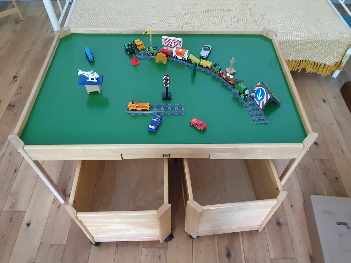 Play table with large storage boxes on wheels. - Image 1