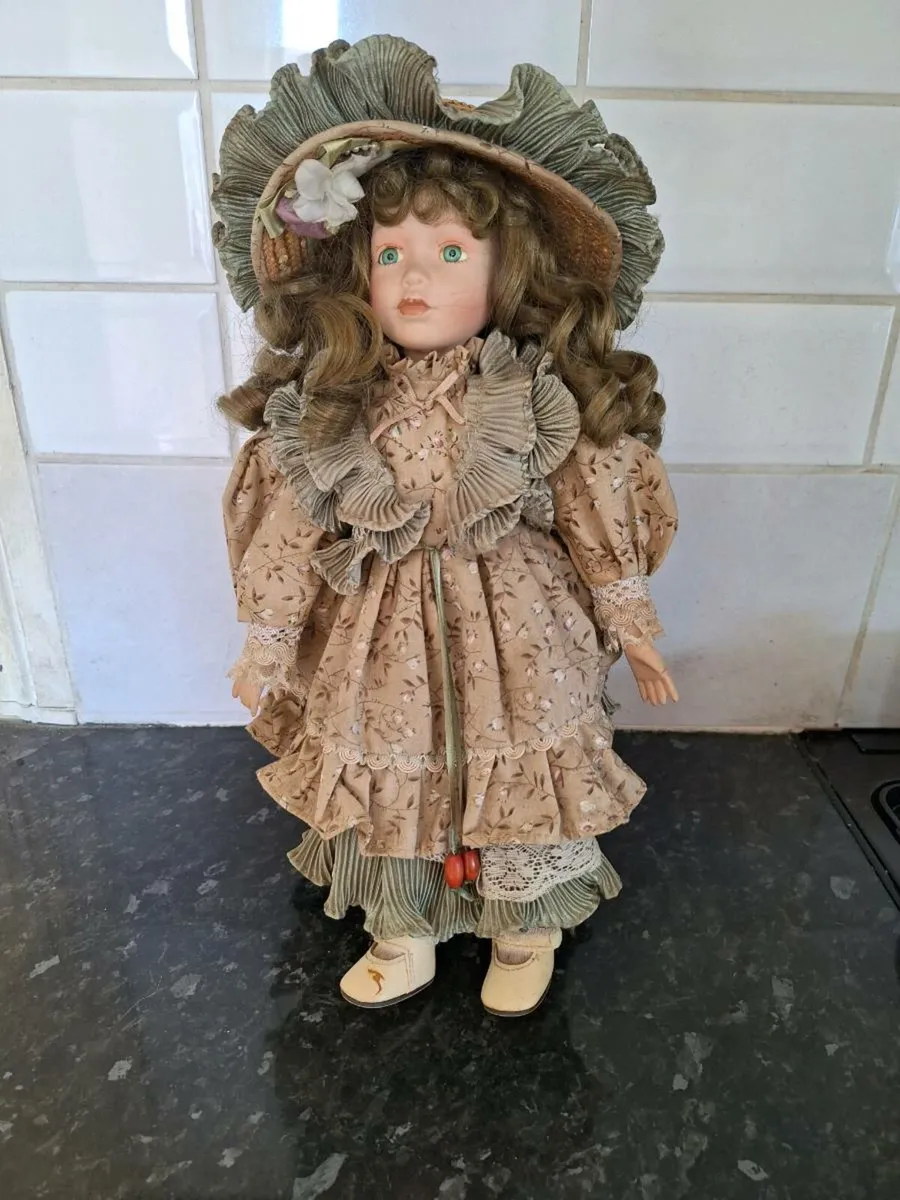 Vintage porcelain doll on stand - Image 1