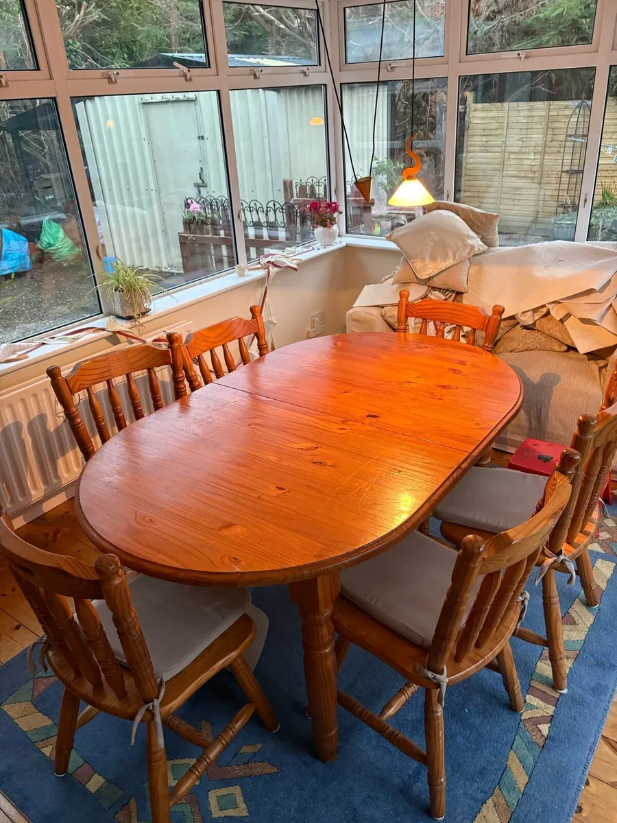 Extendable solid wood dining table and chairs - Image 1