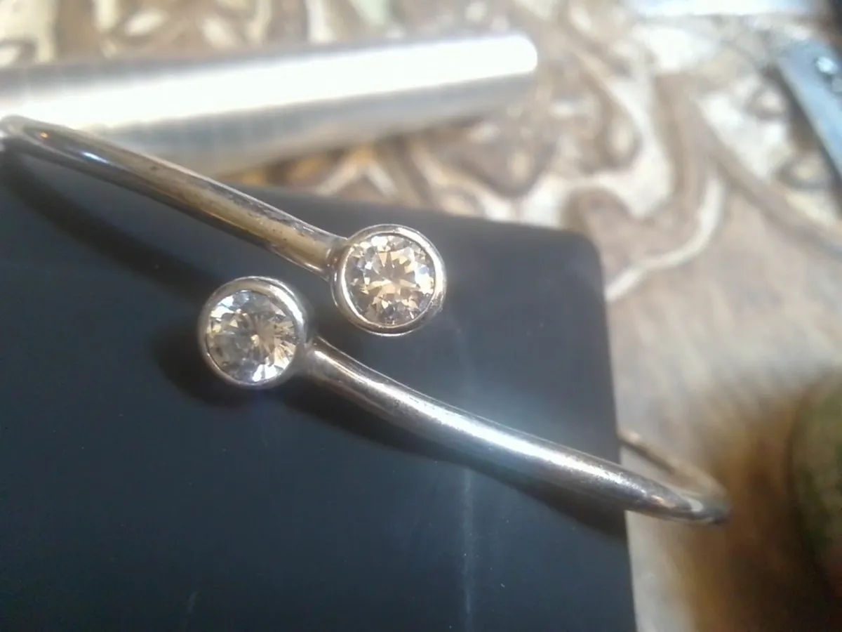 STERLING SILVER VINTAGE WHITE TOPAZ TORC BANGLE - Image 1
