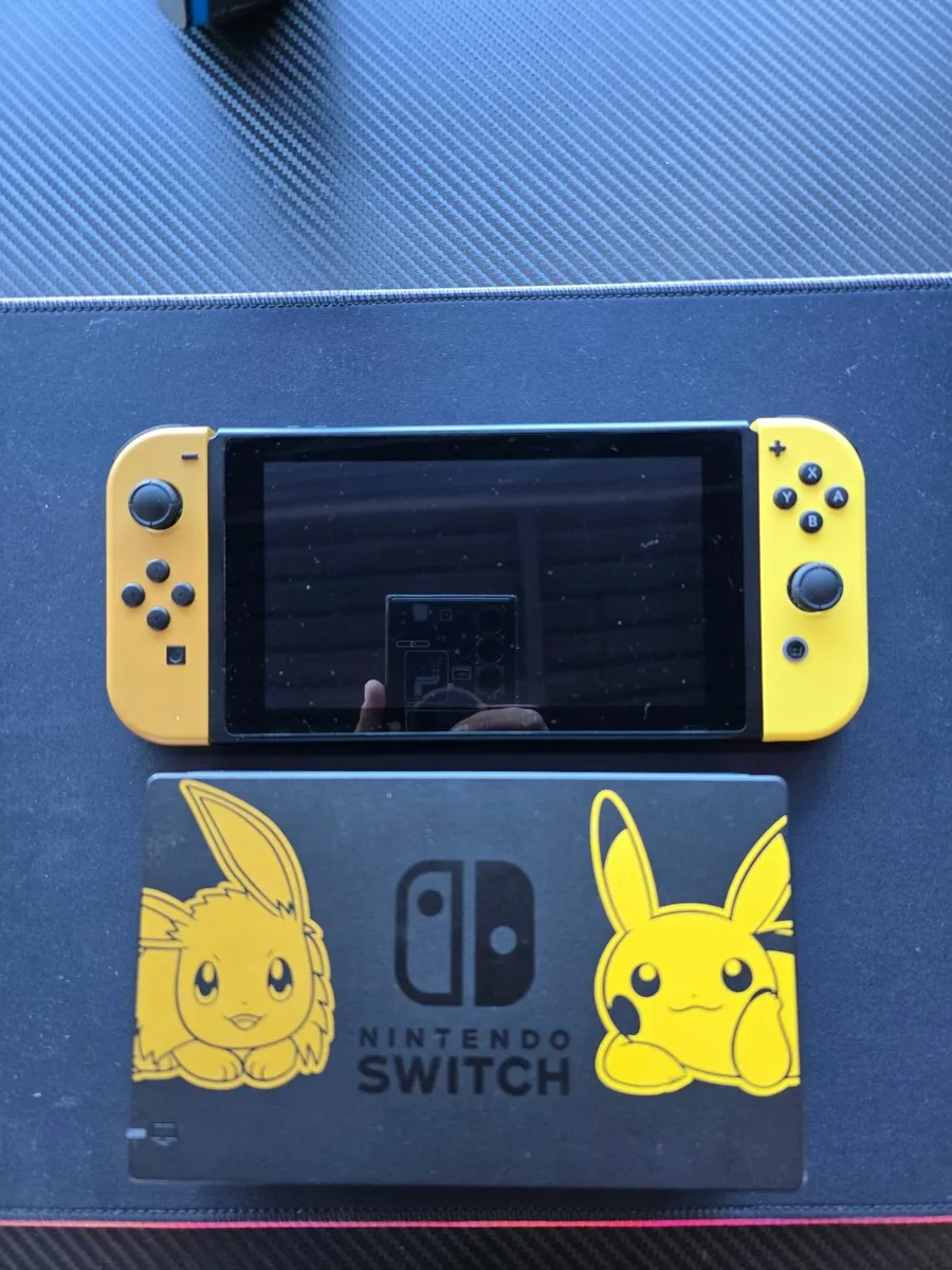 Nintendo Switch Pikachu & Eevee Edition + Extras - Image 1