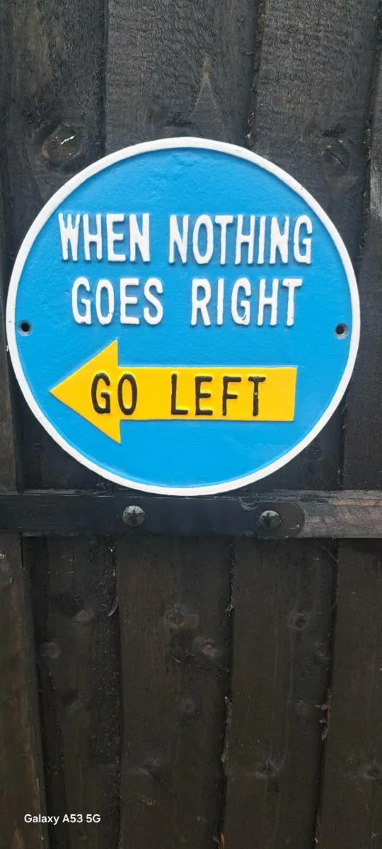 Go left cast iron sign