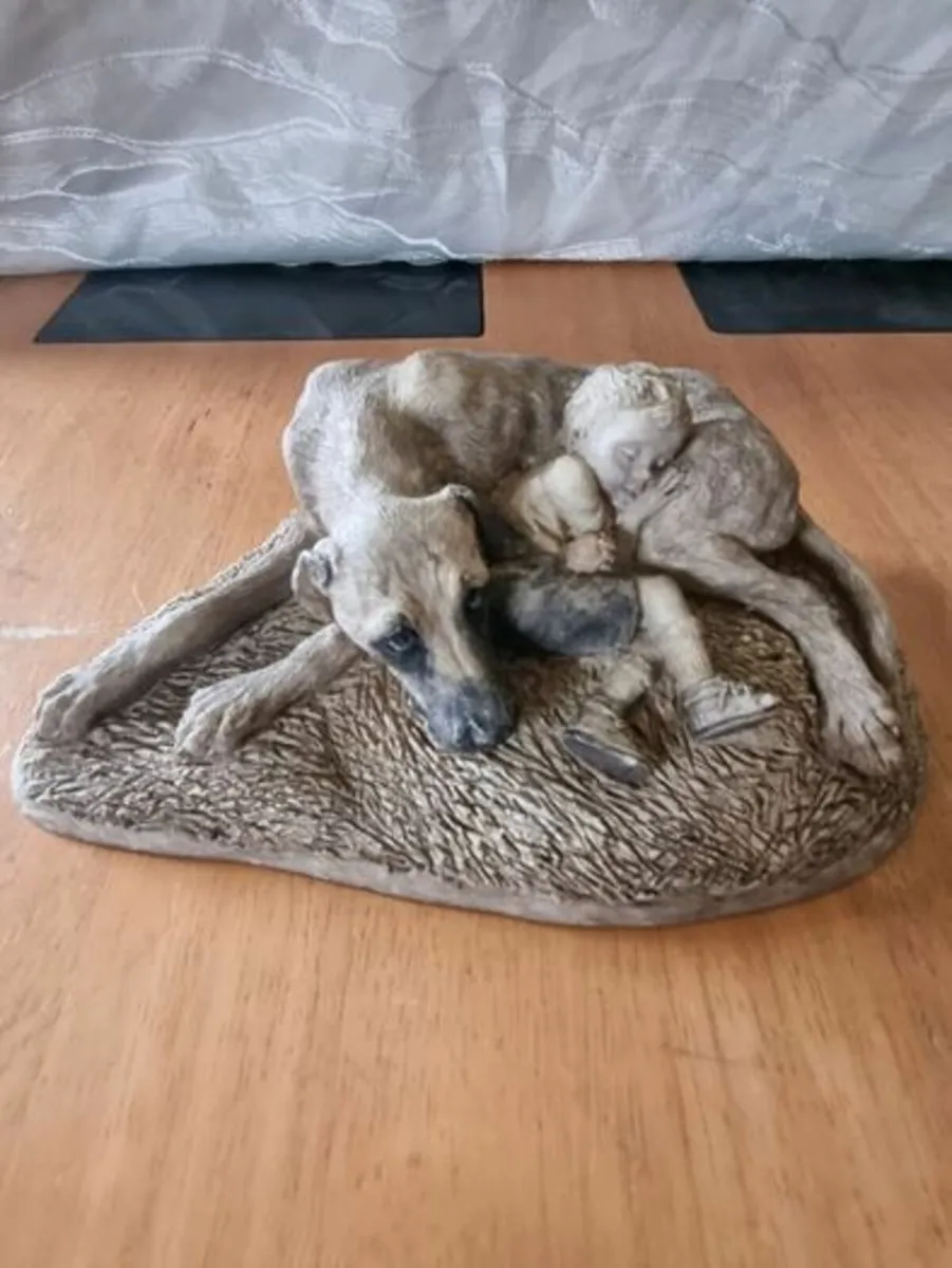 Sculpture of a boy sleeping with a dog - Image 1